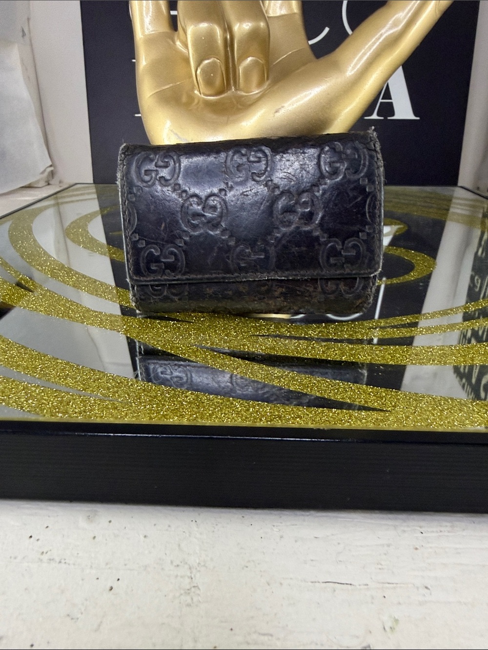 Gucci Black Embossed Monogram Leather Trifold Wallet